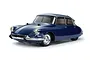 A studio shot of a Tamiya 1/10 scale Citroen DS RC car model in dark blue, featuring chrome bumpers and detailed wheels on a white background.