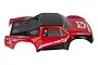 A pre-painted red and black Team Associated Pro4 SC10 short course truck body shell with General Tire branding.