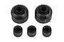 Team Associated RC spare parts including two black plastic differential housings and three black plastic outdrive cups on a white background.