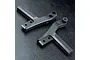 Two black metal MST upper deck connector parts for an RC chassis, shown from an overhead angle on a dark textured surface.