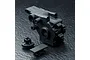 Black plastic MST rear gearbox casing set components on a textured black surface.
