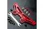 MST red aluminium rear shock mount set with adjustment tool and hardware on a black textured surface.