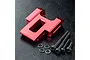 A red anodized aluminium rear upper deck connector for an RC car, accompanied by four black hex screws and four small washers on a black textured surface.