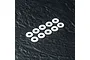 Ten white, smooth O-rings arranged in two rows on a dark, textured surface.