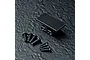 Black aluminium gyro mount for RC cars with a set of small black mounting screws on a textured dark surface.