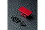 A red anodized aluminium gyro mount for RC cars, shown with a set of black metal screws on a dark textured surface.