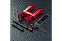 MST red aluminium integrated upper deck connector set with included screws, washers, and a small MST decal sheet on a textured black surface.