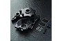 MST black aluminium gearbox housing set including two housing halves, screws, washers, and two MST logo stickers on a black textured surface.