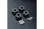 A set of four black aluminium 12mm wheel hexes with clamping screws and pins on a black textured surface.
