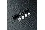 MST black aluminium adjustable suspension arm mount with four white plastic inserts on a dark textured surface.