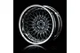 A studio shot of a black and silver mesh-style RC car rim against a black background.