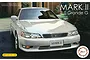 Box art for a Fujimi 1/24 scale Toyota Mark II Grande G model kit featuring a white sedan parked in front of a building.