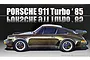 Box art for a Fujimi 1/24 scale 1985 Porsche 911 Turbo plastic model kit, featuring a side profile illustration of a metallic bronze Porsche 911.
