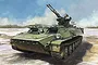 Box art illustration of a green MT-LB military vehicle with a ZU-23-2 anti-aircraft gun mounted on top, set against a painted outdoor landscape.