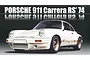 A studio shot of a white 1974 Porsche 911 Carrera RS model car against a dark background with reflective text above.