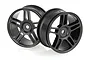 Two black plastic RC car rims with a five-spoke design against a white background.
