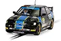 A 1/32 scale Scalextric slot car model of a black and blue Ford Escort Cosworth rally car driven by Rod Birley, featuring racing decals and gold wheels.