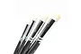 A set of four synthetic dry brushes with black handles and silver ferrules, arranged in a row against a white background.