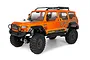 HPI Venture Wayfinder 1/10 scale RC rock crawler in bright orange with black trim, roof rack, and off-road tires on a white background.