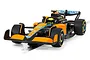 A 1/32 scale Scalextric McLaren MCL36 slot car in orange, black, and light blue livery, featuring the number 4 and sponsor logos.