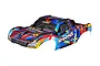 Traxxas 1/8 Maxx SC painted body shell in Rock n Roll design with blue, red, and yellow abstract patterns.