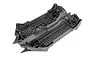 A grey molded plastic main chassis for a Traxxas RC vehicle, featuring a honeycomb reinforcement pattern on the base.