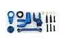 A set of blue anodized aluminium steering assembly components for an RC car, including bell cranks, a drag link, screws, and bushings on a white background.