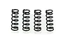 Four identical black metal coil springs arranged in a row against a plain white background.
