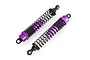Two purple anodized aluminium RC truck shock absorbers with black springs on a white background.