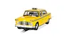 A 1/32 scale Scalextric 1977 NYC Taxi slot car in yellow, featuring a checkerboard pattern and driver figure, positioned on a slot car track.