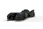 A 1/32 scale Scalextric 1989 Batmobile slot car in matte black, shown from a low-angle front three-quarter view on a white background.