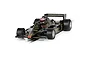 A 1/32 scale Scalextric Lotus 79 Formula 1 slot car in black and gold livery with number 5, sitting on a track section.