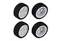 Four Team Associated 1/14 scale Hoonitruck RC wheels with white six-spoke rims and black treaded rubber tires.
