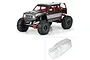 Pro-Line 1/6 Coyote Grand clear unpainted RC body shell shown alongside a fully painted and assembled RC crawler.