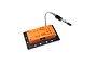 Spektrum soldering jig featuring an orange base with various connector ports and a flexible metal helping hand clip on a black mounting plate.