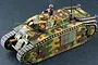 A painted 1/56 scale model of a French Char B1 Bis tank with camouflage paint, featuring a tank commander figure in the open hatch.