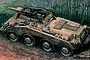 Box art illustration of an Italeri 1/35 scale Sd. Kfz. 234/3 armoured vehicle moving through a wooded area.