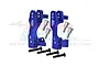 A pair of blue anodized aluminium steering hub carriers (C-hubs) for RC cars, with included metal screws and pins, set against a white background.