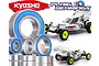 A collection of metal ball bearings with blue rubber seals displayed in front of two Kyosho Ultima RC buggy models.