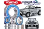 A collection of metal ball bearings with blue rubber seals displayed alongside images of a silver Kyosho Outlaw Rampage RC truck.