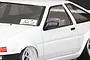 A close-up of a white 1/10 scale RC AE86 body shell featuring a black side door mirror installed on the driver's side.