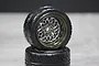 Two Pandora RC 1/10 scale Glow Star road display wheels in black with a detailed silver mesh spoke design, stacked on a grey surface.