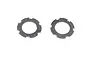 Two circular dark grey slipper clutch gaskets with notched edges on a white background.