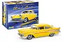 A Revell 1/25 scale 1957 Chevrolet Bel Air plastic model kit box with a finished yellow model car displayed in front.