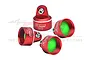 Four red anodized aluminium RC shock absorber caps from GPM Racing with green internal seals, arranged on a white background.