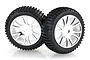 Two black rubber RC monster truck tyres with knobby tread mounted on shiny chrome-plated multi-spoke plastic wheels against a white background.