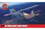 Airfix 1/48 scale De Havilland Tiger Moth plastic model kit box art showing the biplane flying over the ocean near an aircraft carrier.