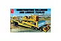 Box art for the AMT 1/25 scale Construction Bulldozer and Lowboy Trailer plastic model kit, featuring an illustration of a yellow bulldozer on a trailer.