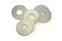 A cluster of six small, circular metal washers arranged on a plain white background.