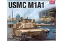 Box art for Academy 1/72 scale USMC M1A1 tank plastic model kit showing a desert-tan tank with War Pig written on the barrel in a Middle Eastern city setting.